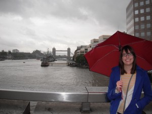 Me on the London Bridge, with Tower Bridge behind me. Umbrella too, 'cause it's London.